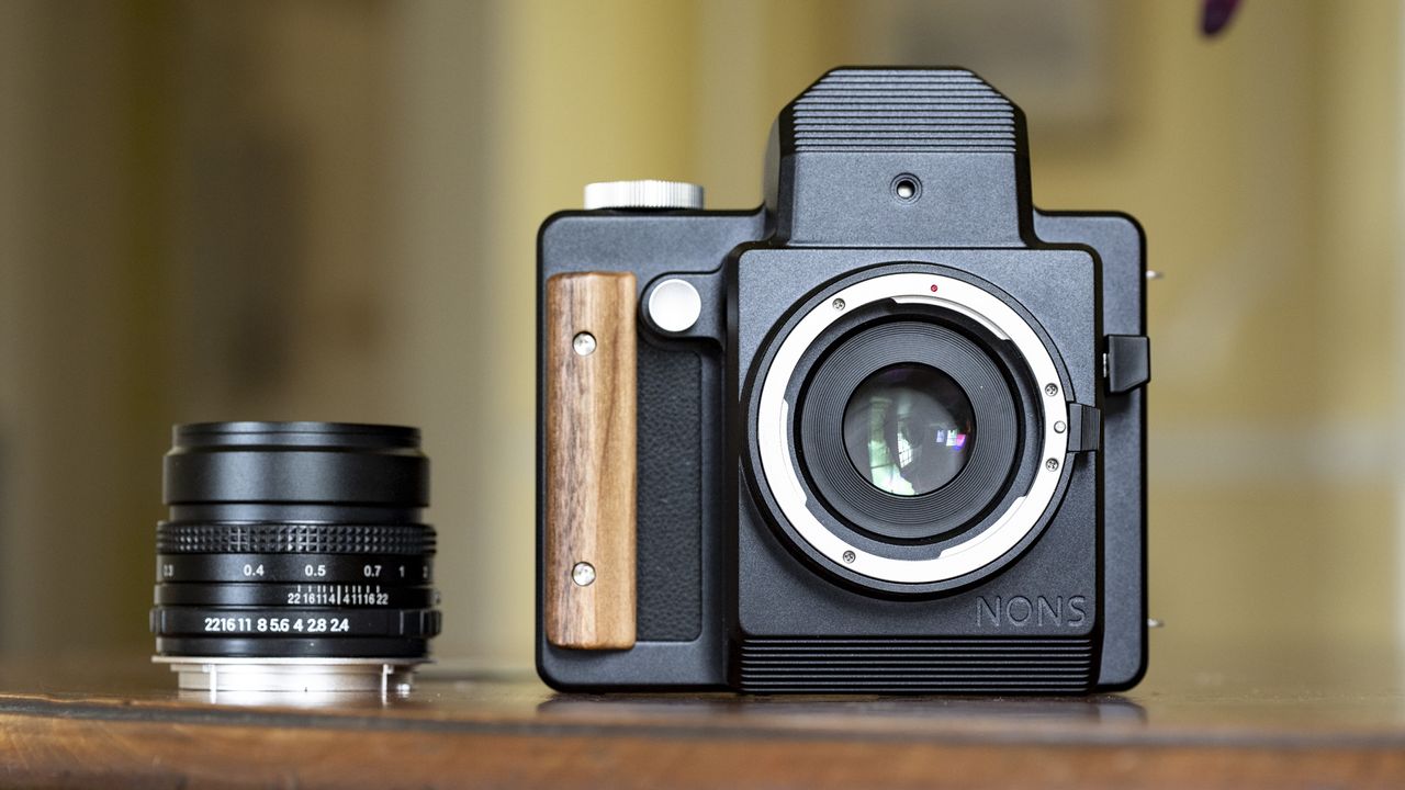 Nons SL660 instant camera alongside the Nons 35mm f/2.8 lens