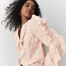 A model wearing a Marks and Spencer ruffle blouse. 