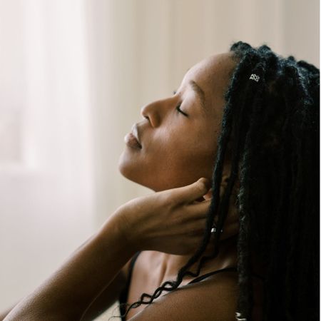 A woman lying on a sofa tired