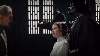 Leia speaking to grand moff tarkin with Darth Vader looking on in Star Wars: A New Hope