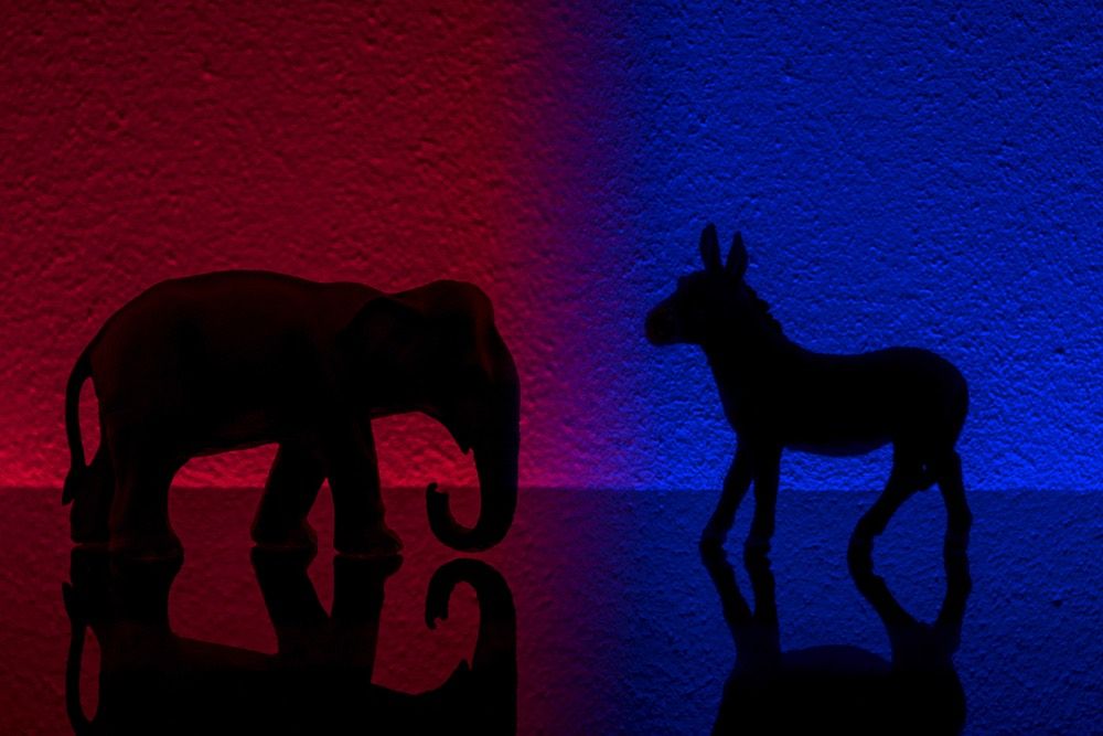 Democrats vs republicans are facing off in a ideological duel on blue and red backgrounds. I