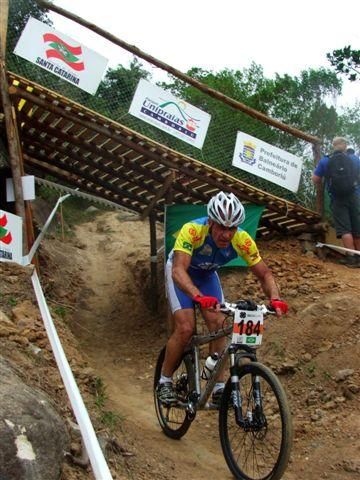 A men's 45-49 racer speeds under the downhill track.