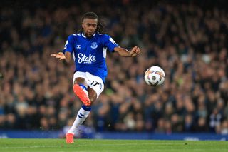 Alex Iwobi of Everton scores their 1st goal during the Premier League match between Everton FC and Manchester United at Goodison Park on October 9, 2022 in Liverpool, United Kingdom.