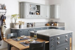small kitchen island idea in a grey kitchen with white countertops