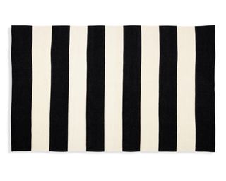 A black and white striped outdoor rug