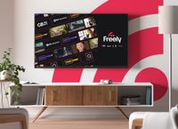 A TV displays the home screen for streaming service Freely. It features a selection of the new shows on offer, such as PBS America. 