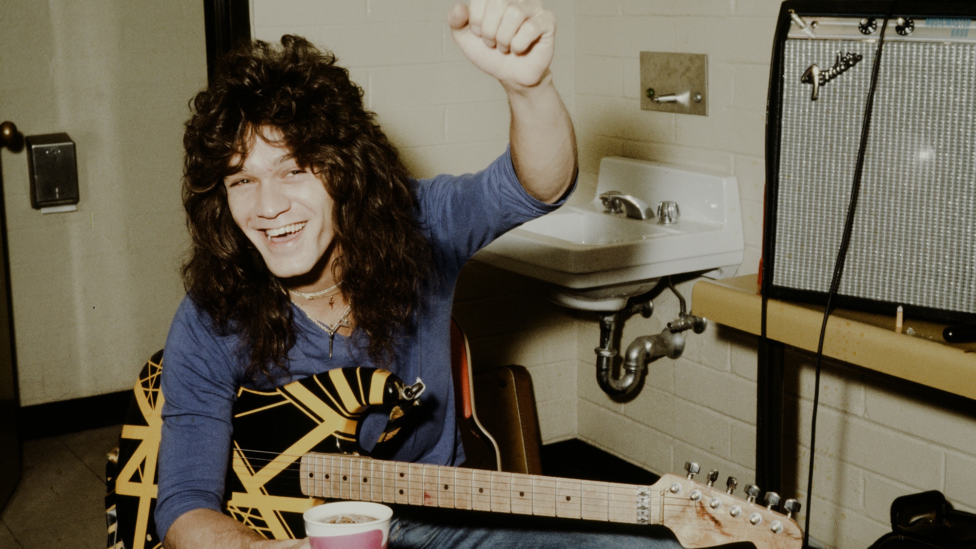 Eddie Van Halen at a backstage in a venue in Arizona during their "World Vacation Tour" (supporting their 2nd album) in US