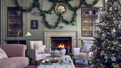 Living room with fireplace decorated for Christmas