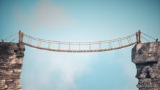 A rope bridge strung between two cliffs. 