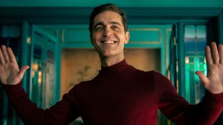 Berlin (Pedro Alonso) with arms outstretched in a red turtleneck in Money Heist: Berlin episode 2