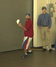 Joe Ayoob, left, throwing a paper airplane folded by John Collins, right.