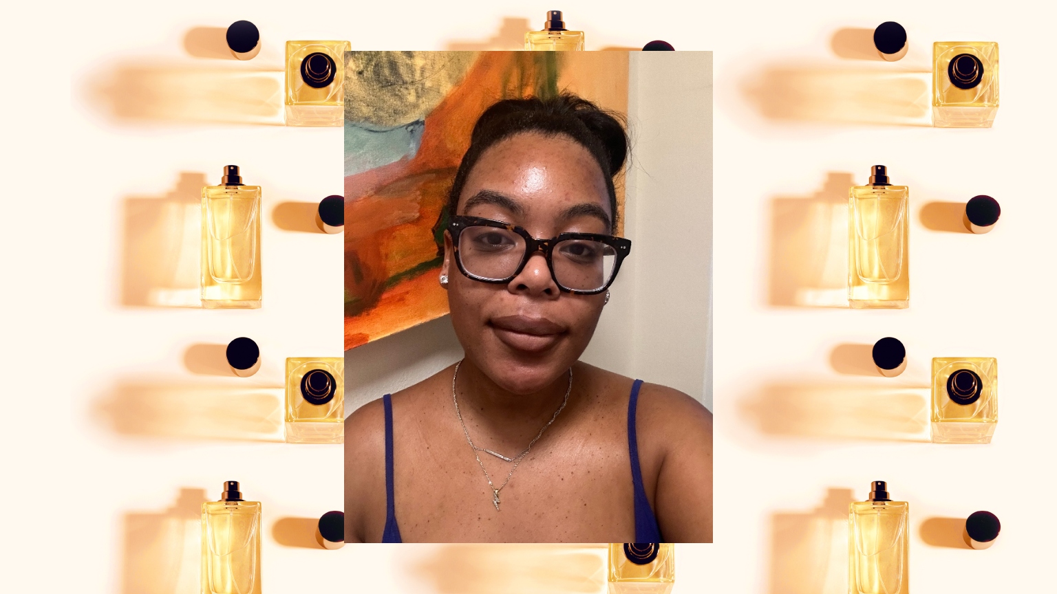 a woman with dark glasses and hair pulled back over a gold and black perfume bottle design