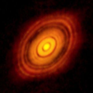 An ALMA image of the young star HL Tau and the disk of gas and dust surrounding it. Rings in such protoplanetary disks indicate regions of pressure maxima, which could establish boundaries that help shape the developing planetary system.