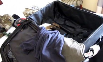 The contents of Sy Haze's luggage are laid out on his hotel bed in a video that shows off his pee-soaked clothes.