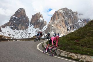 TOPSHOT Team UAEs Slovenian rider Tadej Pogacar R competes in Passo Sella during the 17th stage of the 107th Giro dItalia cycling race 159km between Selva di Val Gardena and Passo del Brocon on May 22 2024 Photo by Luca Bettini AFP Photo by LUCA BETTINIAFP via Getty Images