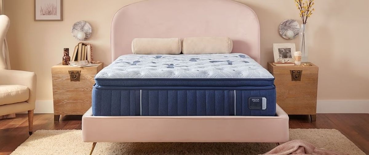 The Stearns &amp; Foster Estate mattress on a pink bed frame in a minimalist bedroom