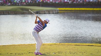 Rickie Fowlers tees off at the famous island hole 17th at TPC Sawgrass on his way to winning The Players Championship in 2015