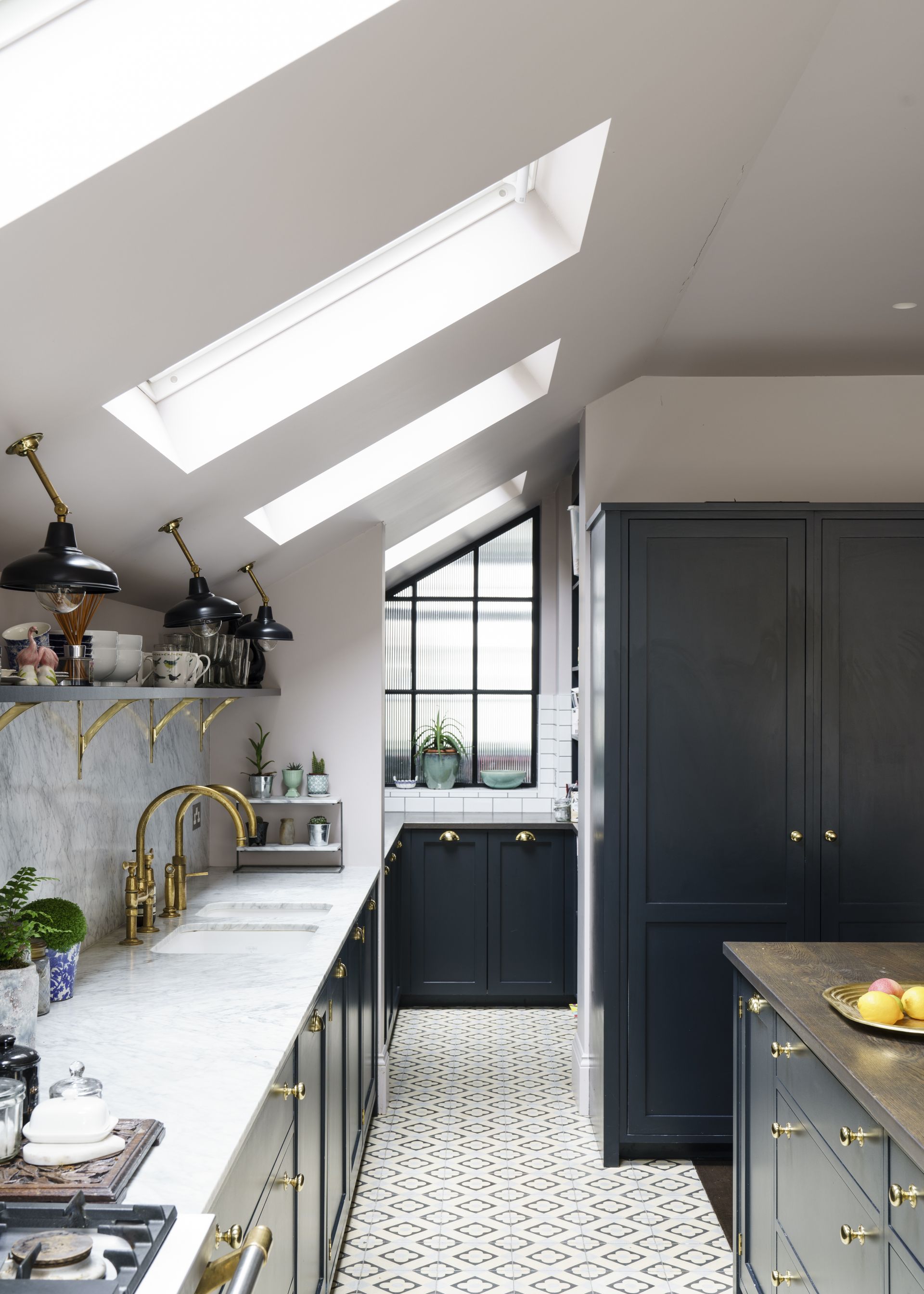 Kitchen with pale countertop and blue cabinets