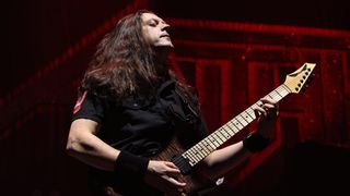 Jonathan Donais of Anthrax performs live with his Dean seven-string.