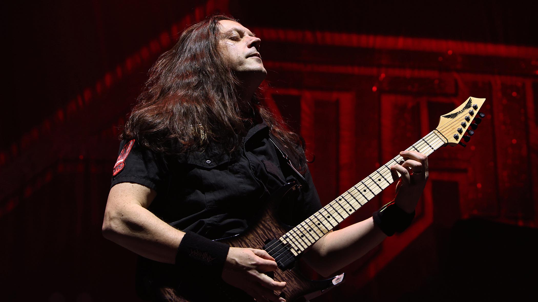 Jonathan Donais of Anthrax performs live with his Dean seven-string.