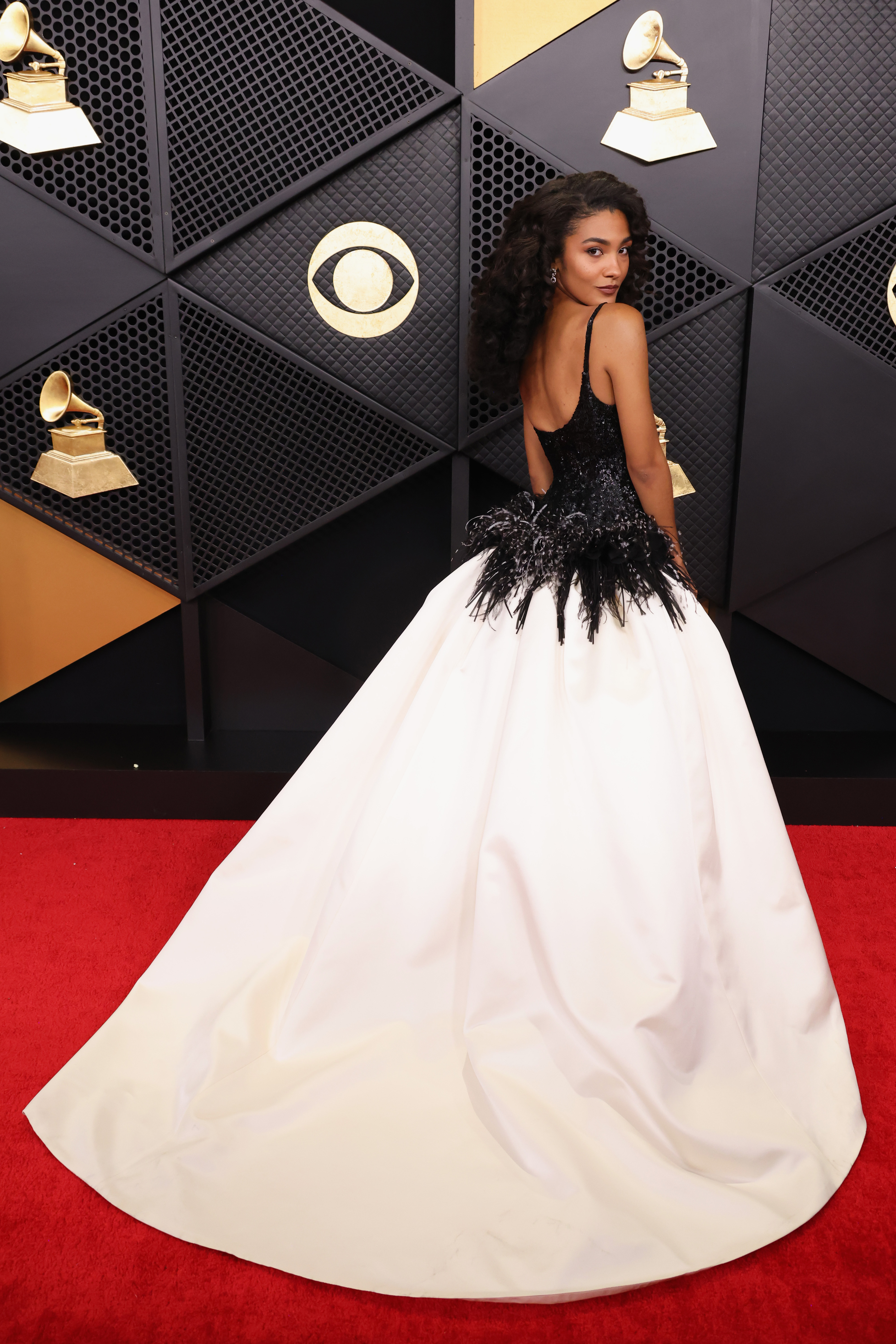 Olivia Dean arrived at the 2026 Grammys in a custom black-and-white Chanel gown