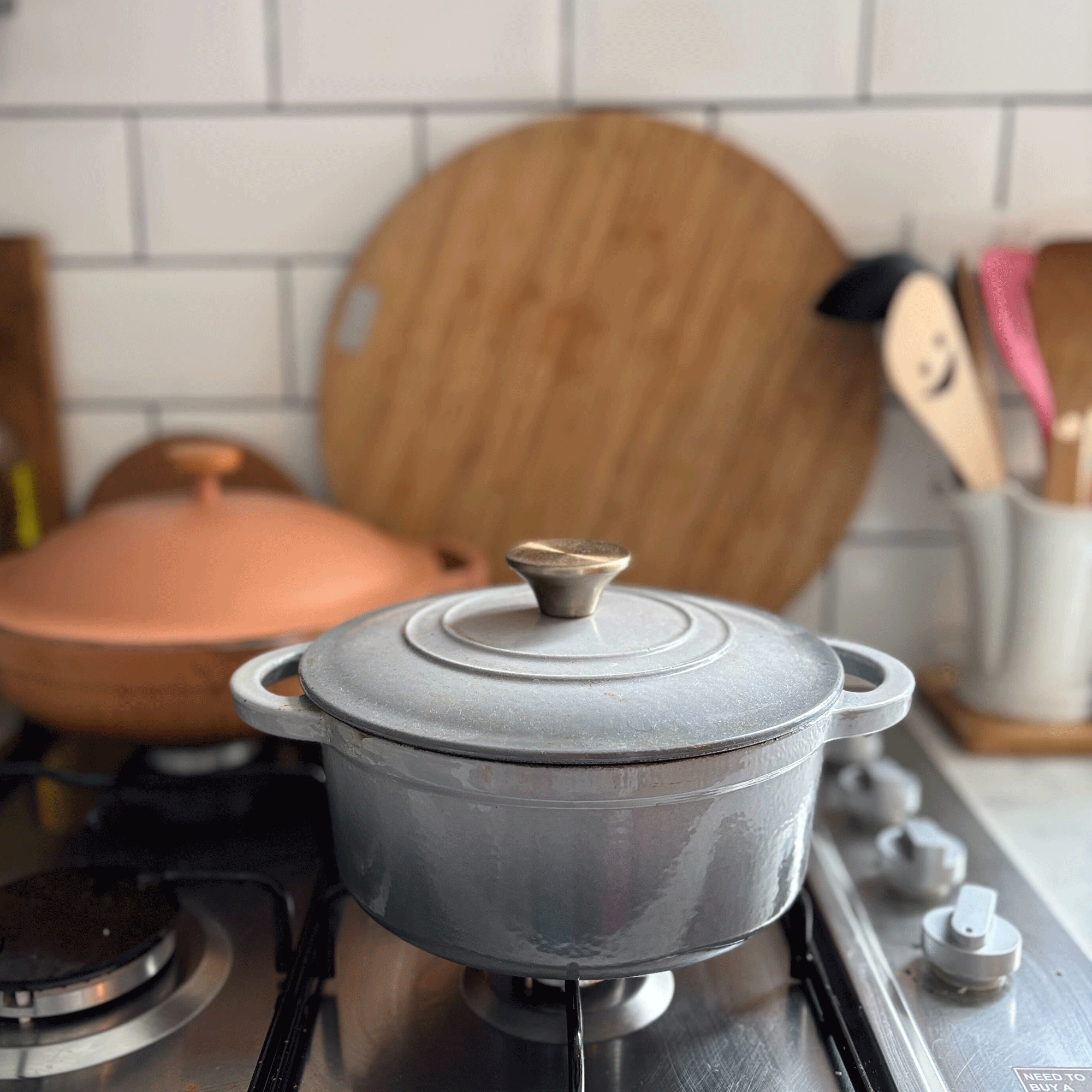 Grey Aldi cast iron dish on a hob
