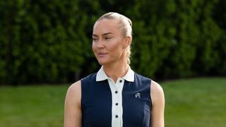 Charley Hull pictured wearing a navy blue Malbon dress