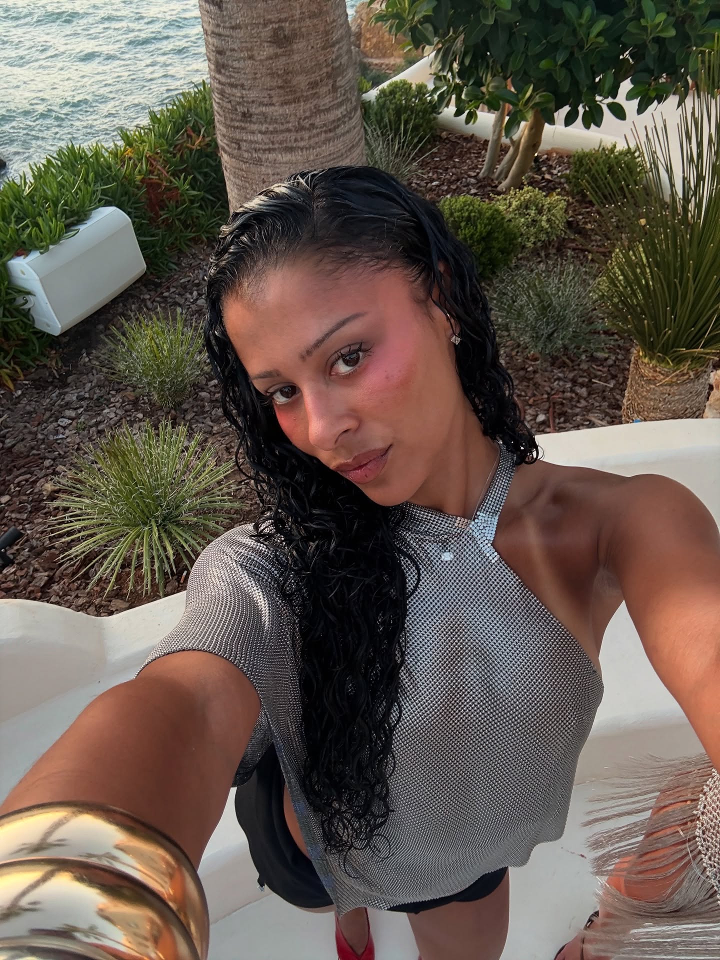 Creator Sami Mir&amp;oacute; wearing makeup in a tropical setting.