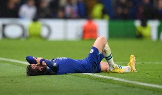 Ben Chilwell of Chelsea goes down with an injury during the UEFA Champions League group E match between Chelsea FC and Dinamo Zagreb at Stamford Bridge on November 02, 2022 in London, England.