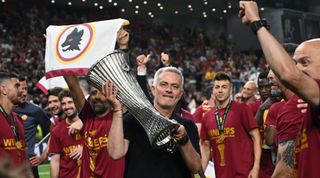 Roma head coach Jose Mourinho celebrates with the trophy after his team won the UEFA Europa Conference League final football match between AS Roma and Feyenoord at the Air Albania Stadium in Tirana on May 25, 2022.