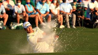 Hideki Matsuyama of Japan plays a shot from a bunker on the 18th hole during the final round of the Masters at Augusta National Golf Club on April 11, 2021 in Augusta, Georgia.