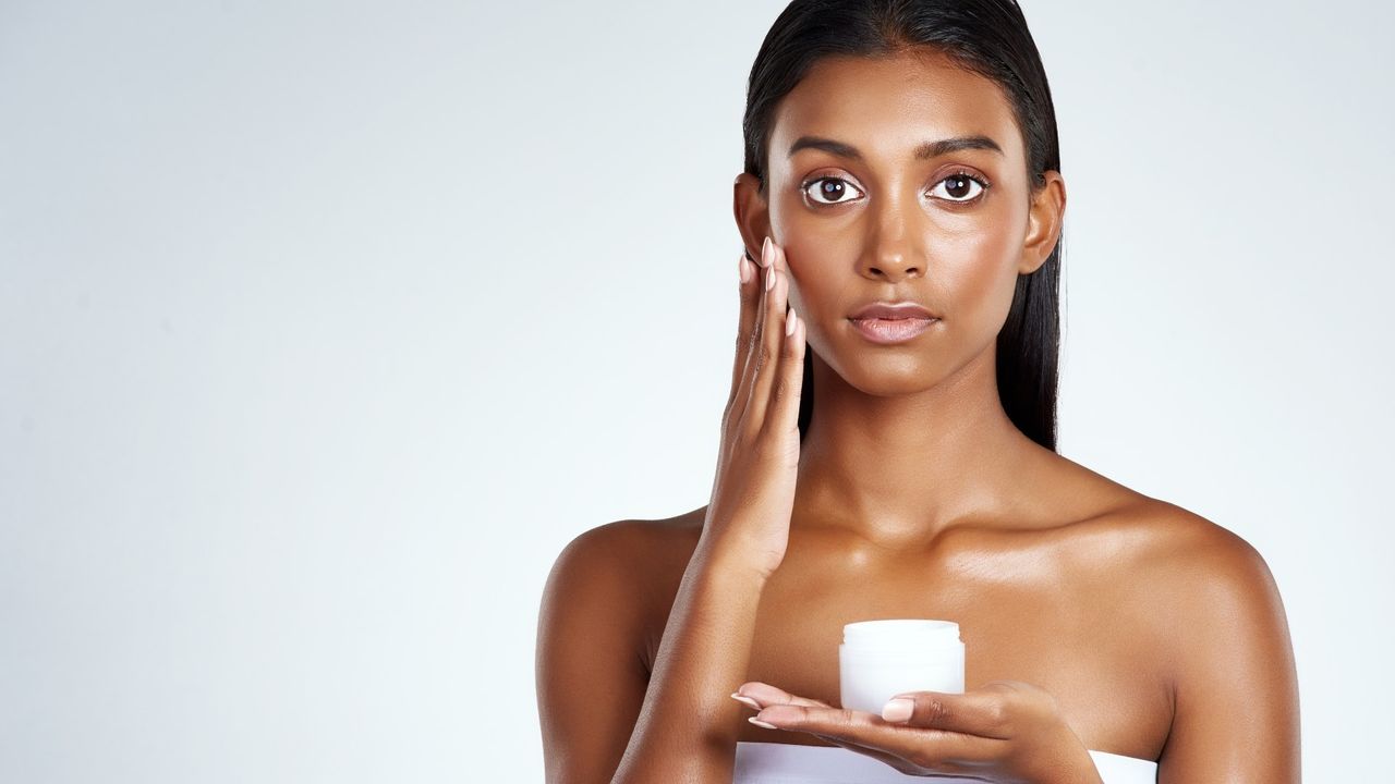 woman applying skincare