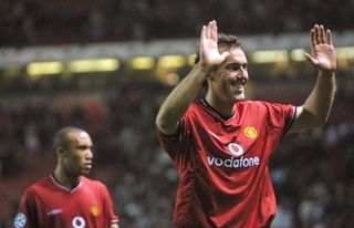 Laurent Blanc acknowledges the fans after Manchester United's win over Lille in the Champions League in September 2001.