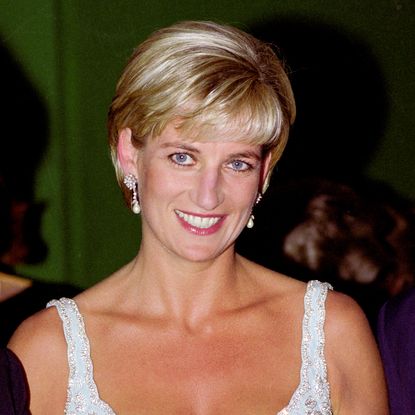 Princess Diana wears a sparkly white dress and has short blonde hair, while her brother Earl Charles Spencer wears a blue suit and has gray hair