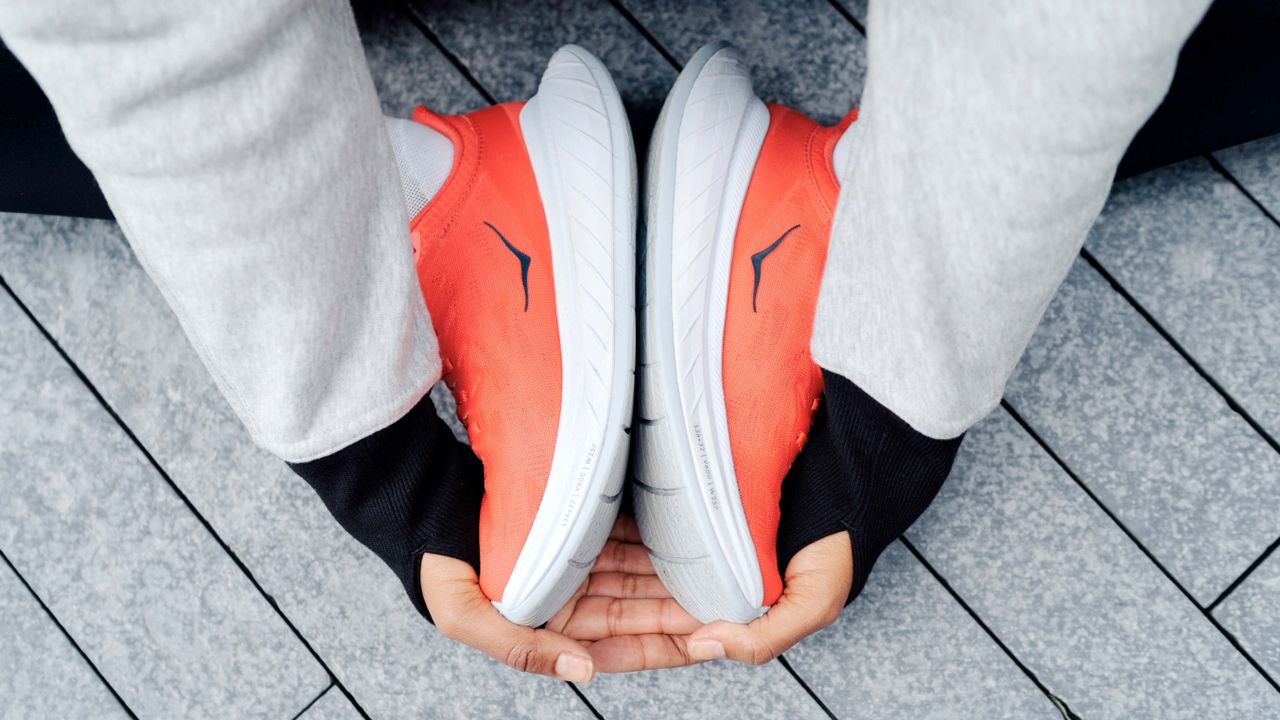 Runner stretching while sittting on the ground