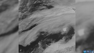 satellite view of A23a amongst the cloud and dark southern ocean waters.