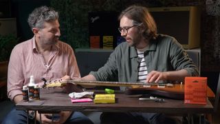 Guitarist Editor Jamie Dickson and Rotosound&rsquo;s Jack Dunwoody changing strings