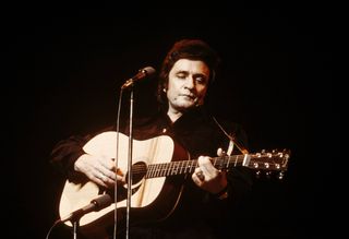 Johnny Cash playing the guitar
