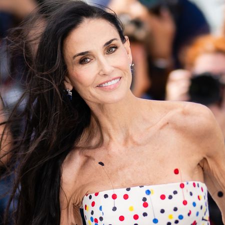 Demi Moore arrived at the 2026 Cannes Film Festival in a multi-color polka-dot little white dress