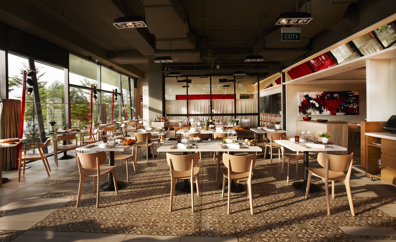 Wide shot of restaurant showing dining area &amp; counter