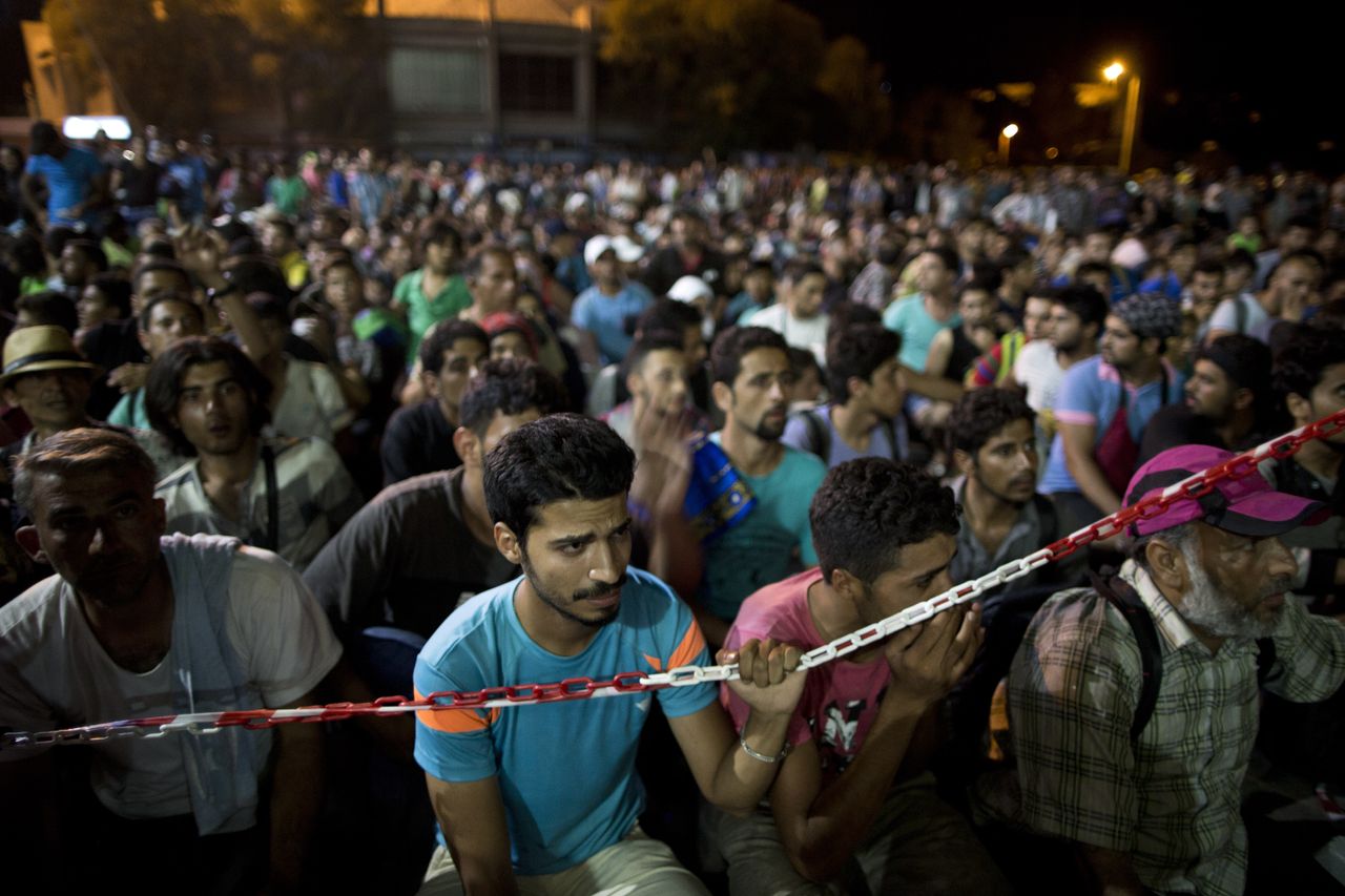 Migrants wait at a Greek island.