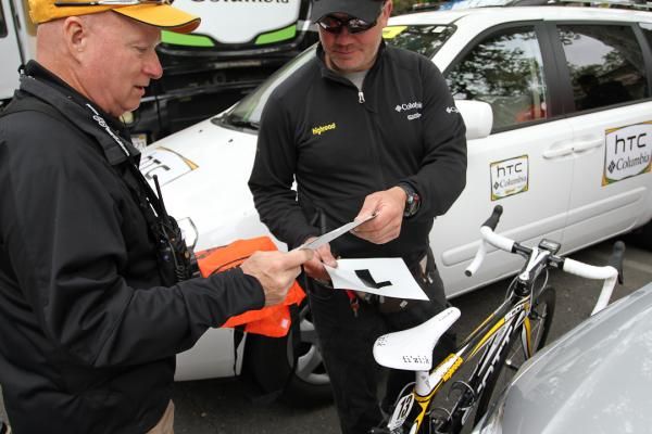 With Mark Cavendish in the leader&rsquo;s jersey, race organizers provide HTC with numeral 1 decals for the two team cars, indicating their position in the race caravan.