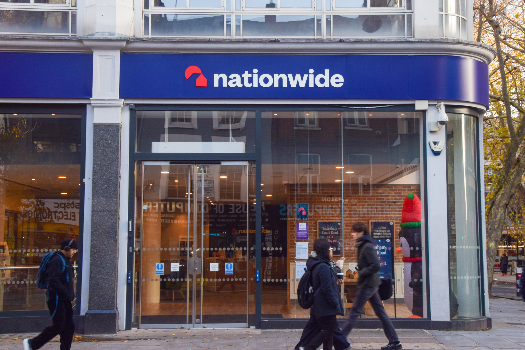 People walk past the Nationwide bank branch in Tottenham Court Road.