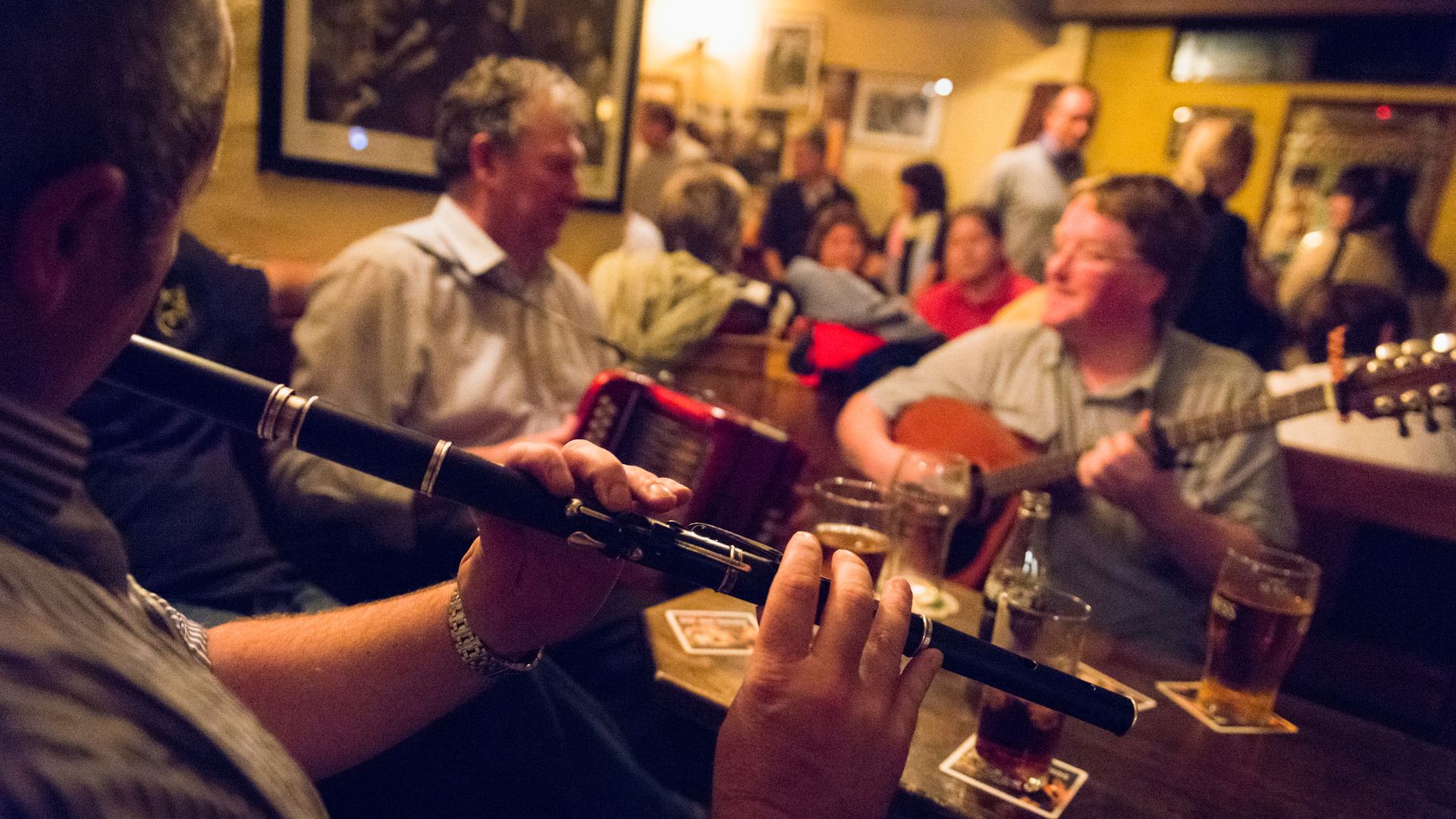 Ireland, Clare County, Doolin . O'Connor's Pub, playing music