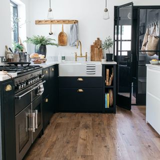 dark shaker kitchen with wood-look vinyl flooring