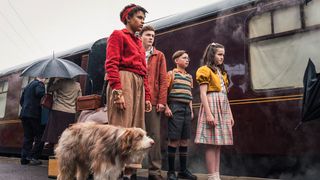 Diaana Babnicova as George, Elliott Rose as Julian, Kit Rakusen as Dick and Flora Jacoby Richardson as Anne with Timmy the dog in "The Famous Five"