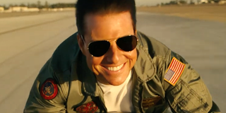 Tom Cruise smiles riding motorcycle Top Gun: Maverick first trailer