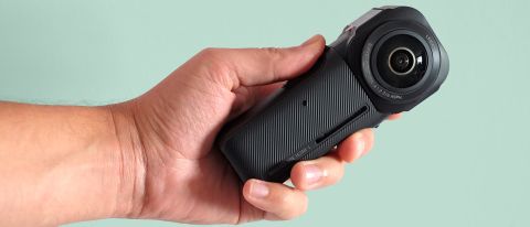 A hand holding the Insta360 ONE RS 1-Inch 360 Edition camera