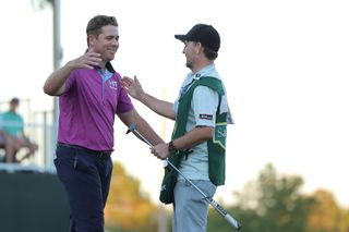 Luke List and his caddie celebrate victory at the Sanderson Farms Championship