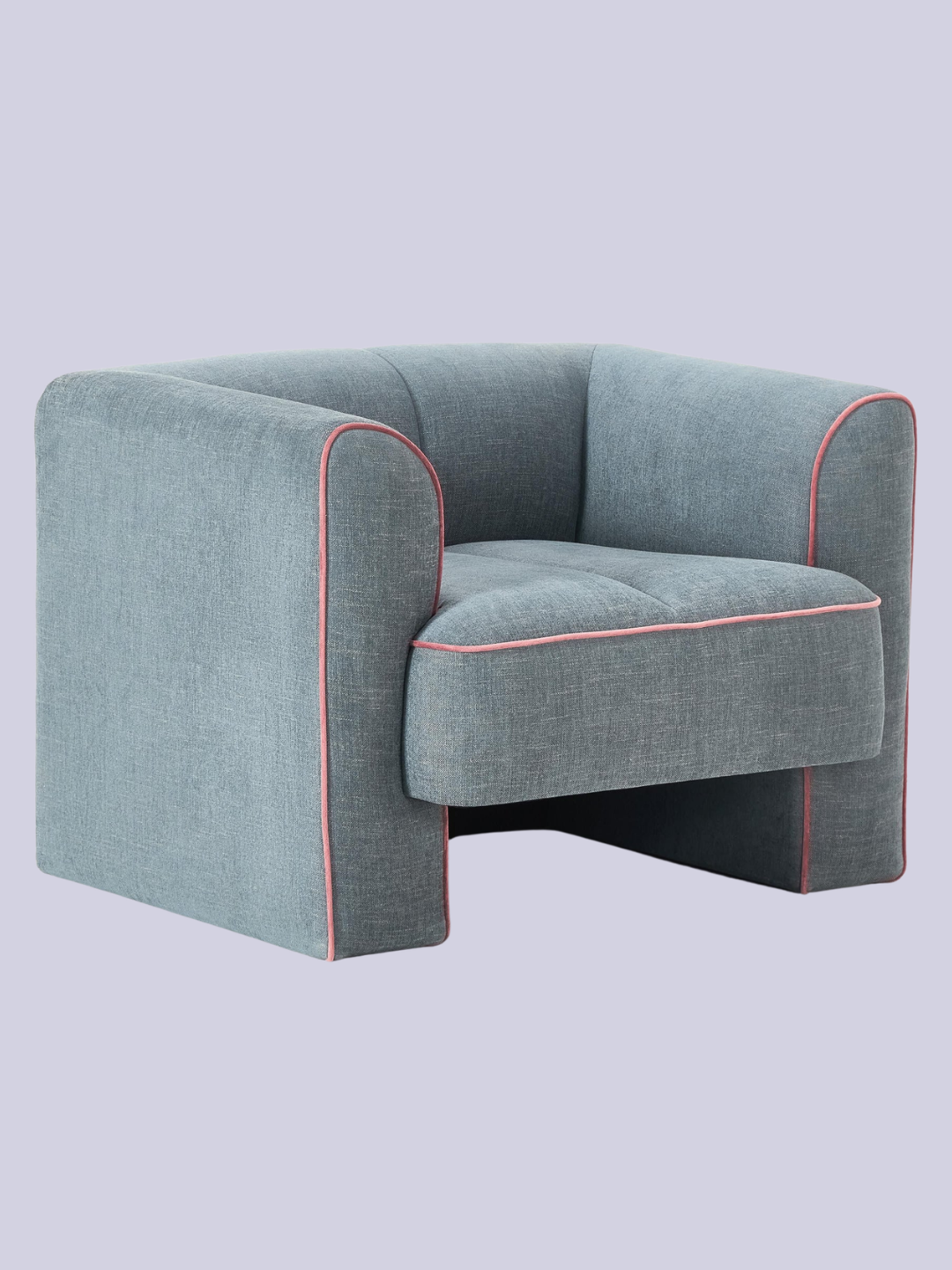 A blue sofa armchair with pink lining from Westwing